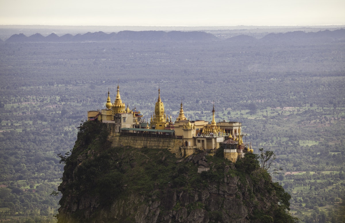 Mount Popa and Taung Kalat of the Mandalay Region, Myanmar. On the foothills of the mountain you will find this beautiful temple perched high up on a hill.