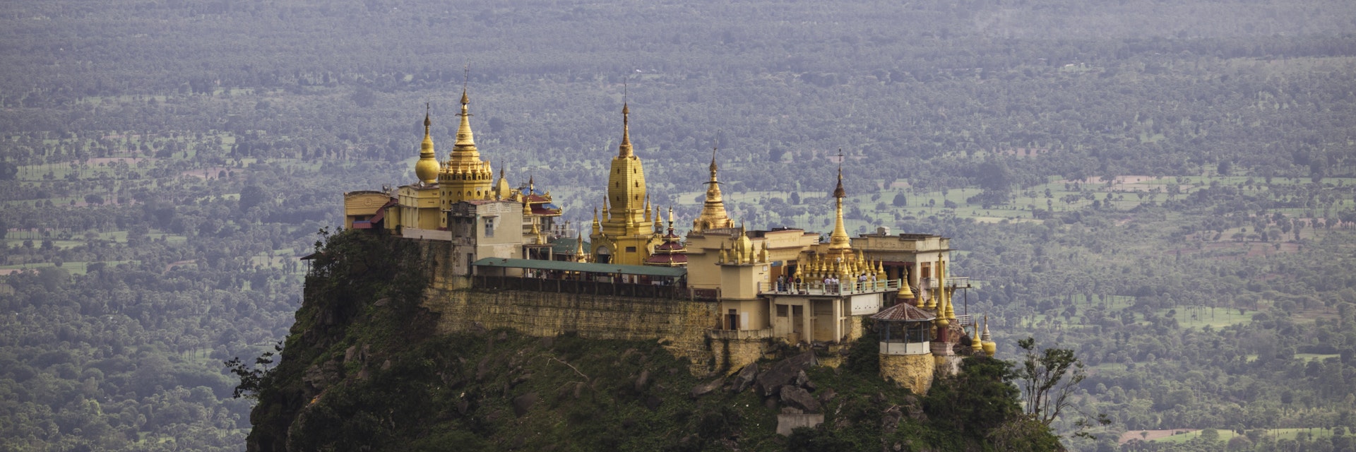 Mount Popa and Taung Kalat of the Mandalay Region, Myanmar. On the foothills of the mountain you will find this beautiful temple perched high up on a hill.