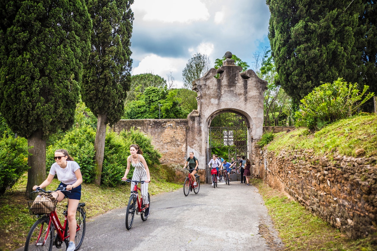 ROME, ITALY - May 2018: Cycling people at the entrance gate to the Catacombe di San Callisto cave historical town in Rome, Italy; Shutterstock ID 1301255716; purchase_order: 65050; job: poi; client: ; other:
1301255716