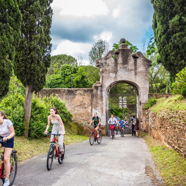 ROME, ITALY - May 2018: Cycling people at the entrance gate to the Catacombe di San Callisto cave historical town in Rome, Italy; Shutterstock ID 1301255716; purchase_order: 65050; job: poi; client: ; other:
1301255716