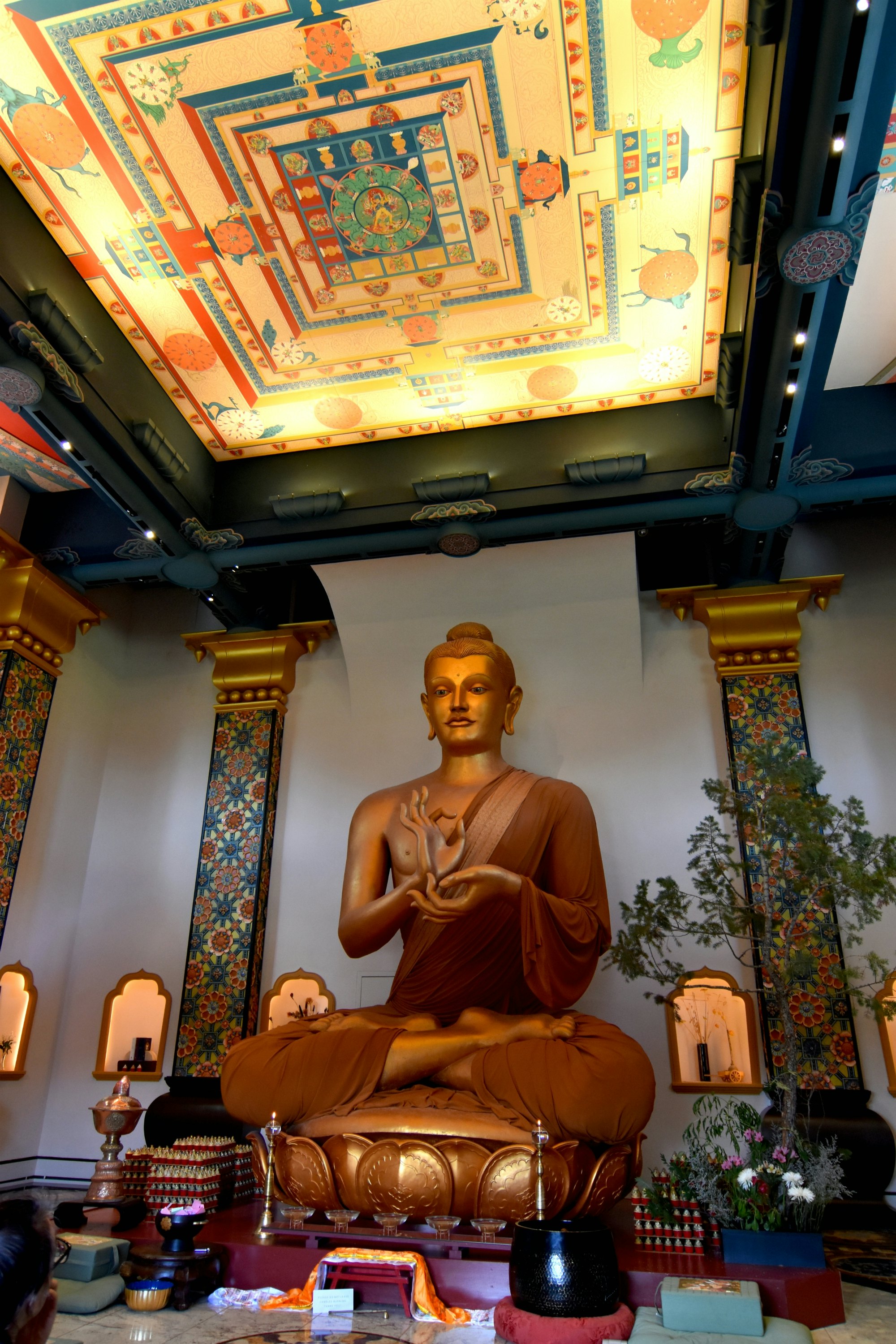 Red Feather Lakes, Colorado - July 9, 2019 : A large golden Buddha inside the Great Stupa of Dharmakaya. The stupa was built in 1988 in the mountains of Colorado.; Shutterstock ID 1454934947; purchase_order: 65050; job: ; client: ; other:
1454934947
