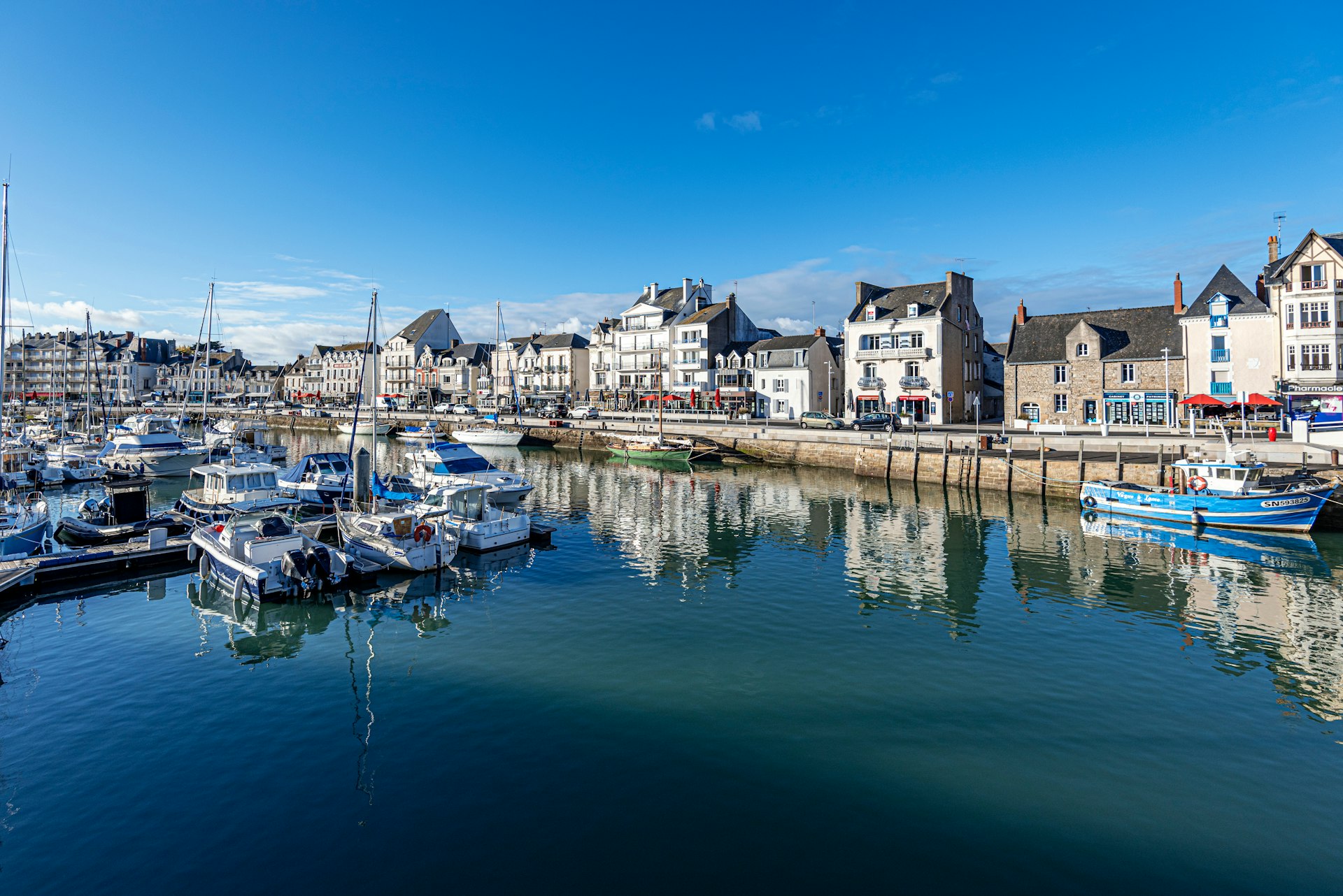 View of  Jules Sandeau Quay and boats moored in the port of Le Pouliguen Channel in La Baule, the seaside resort in Southern Britany. Loire-Atlantic