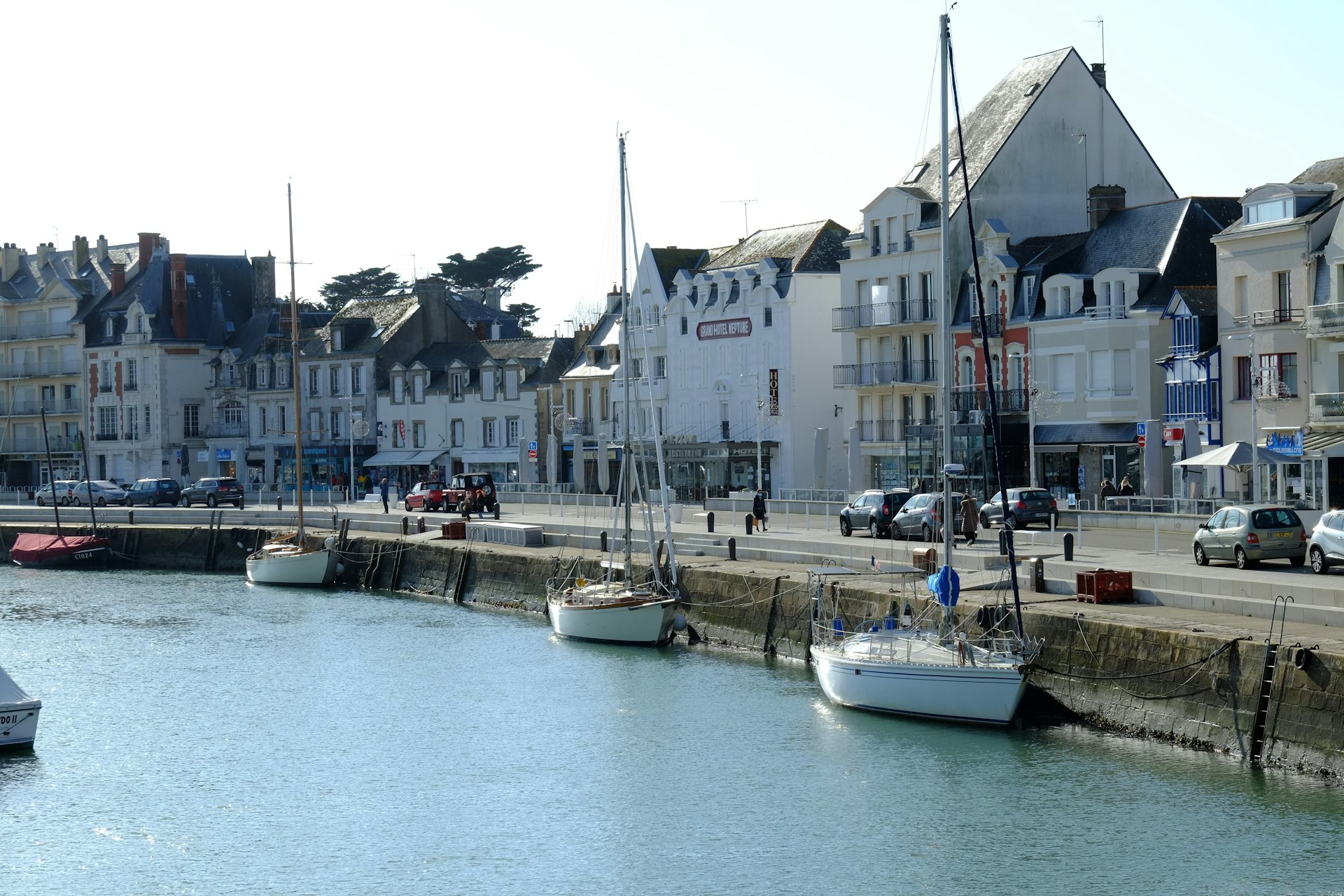 Boats at the whitewashed harbour of La Baule, France