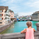 Adorable little girl outdoors in Zurich, Switzerland. Back view of beautiful kid background of cute city; Shutterstock ID 466815716; your: Jennifer Carey; gl: 65050; netsuite: Online Editorial; full: Zürich
466815716
A young girl on a bridge in Zurich, Switzerland looking out at the river.