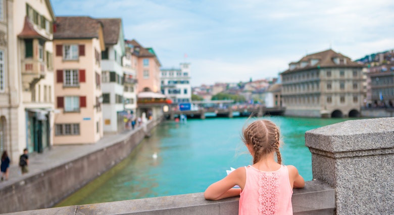 Adorable little girl outdoors in Zurich, Switzerland. Back view of beautiful kid background of cute city; Shutterstock ID 466815716; your: Jennifer Carey; gl: 65050; netsuite: Online Editorial; full: Zürich
466815716
A young girl on a bridge in Zurich, Switzerland looking out at the river.