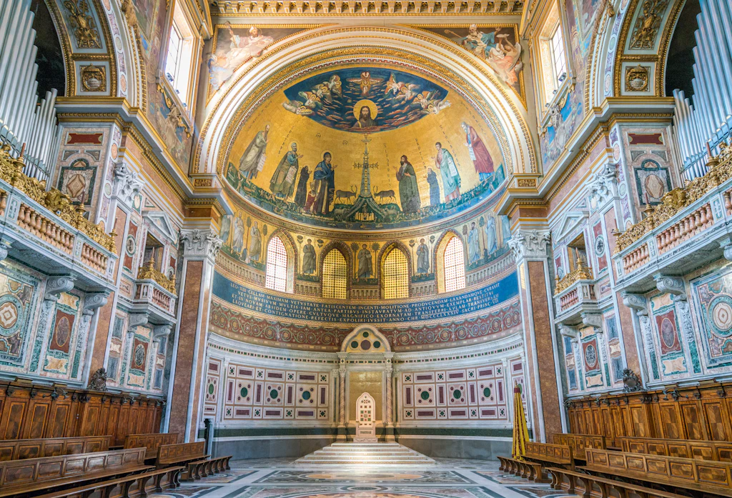 Apse, Basilica of Saint John Lateran in Rome A grand domed space in a church decorated with gold