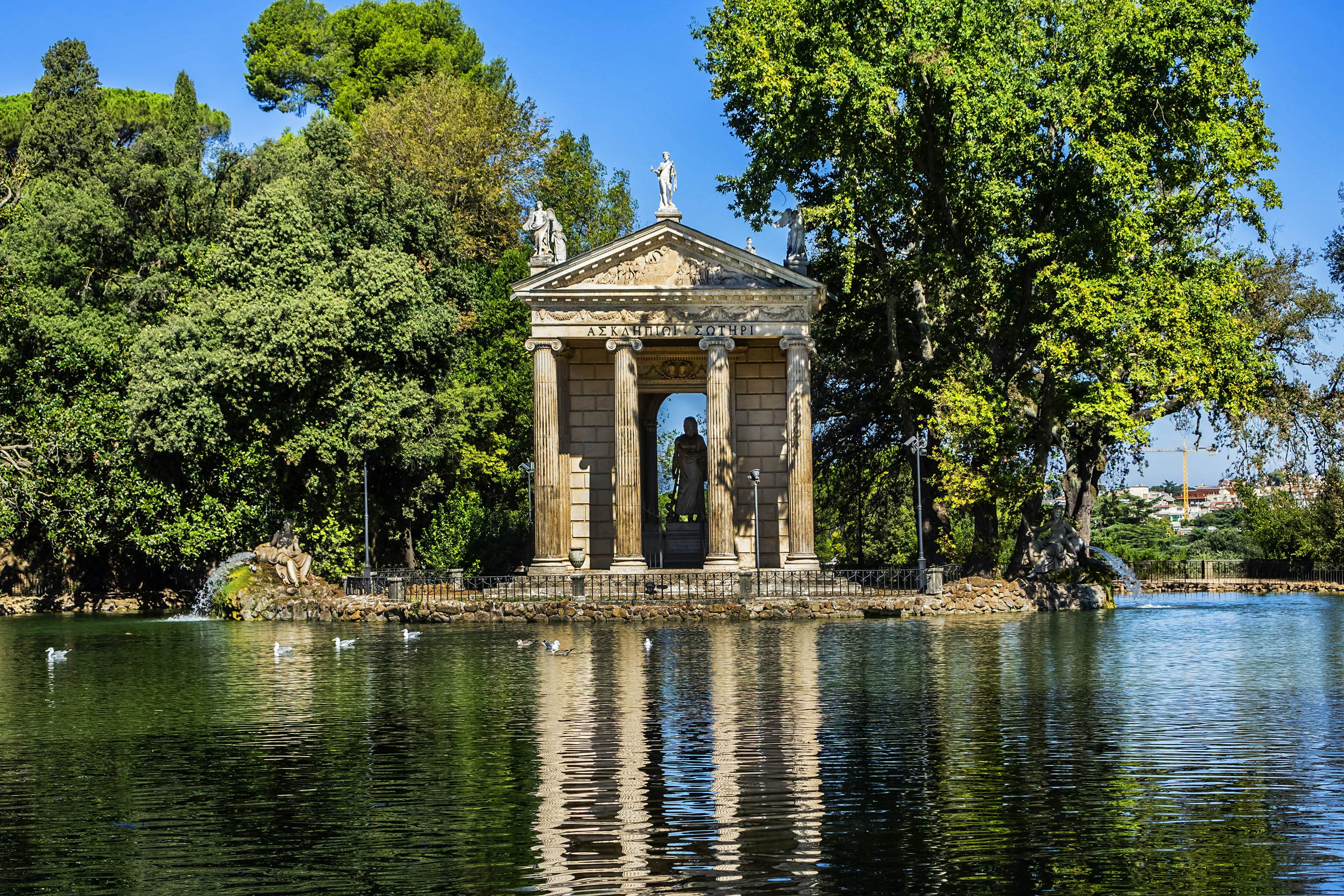 The lakeside Temple of Aesculapius in in the gardens of the Villa Borghese.
1168486960
ancient, architecture, art, attraction, capital, classical, culture, european, famous, gardens, historical, history, holiday, italia, italian, italy, landmark, monument, old, place, roma, roman, rome, sculpture, sightseeing, stone, temple, tourism, tourist, touristic, travel, vacation, villa borghese