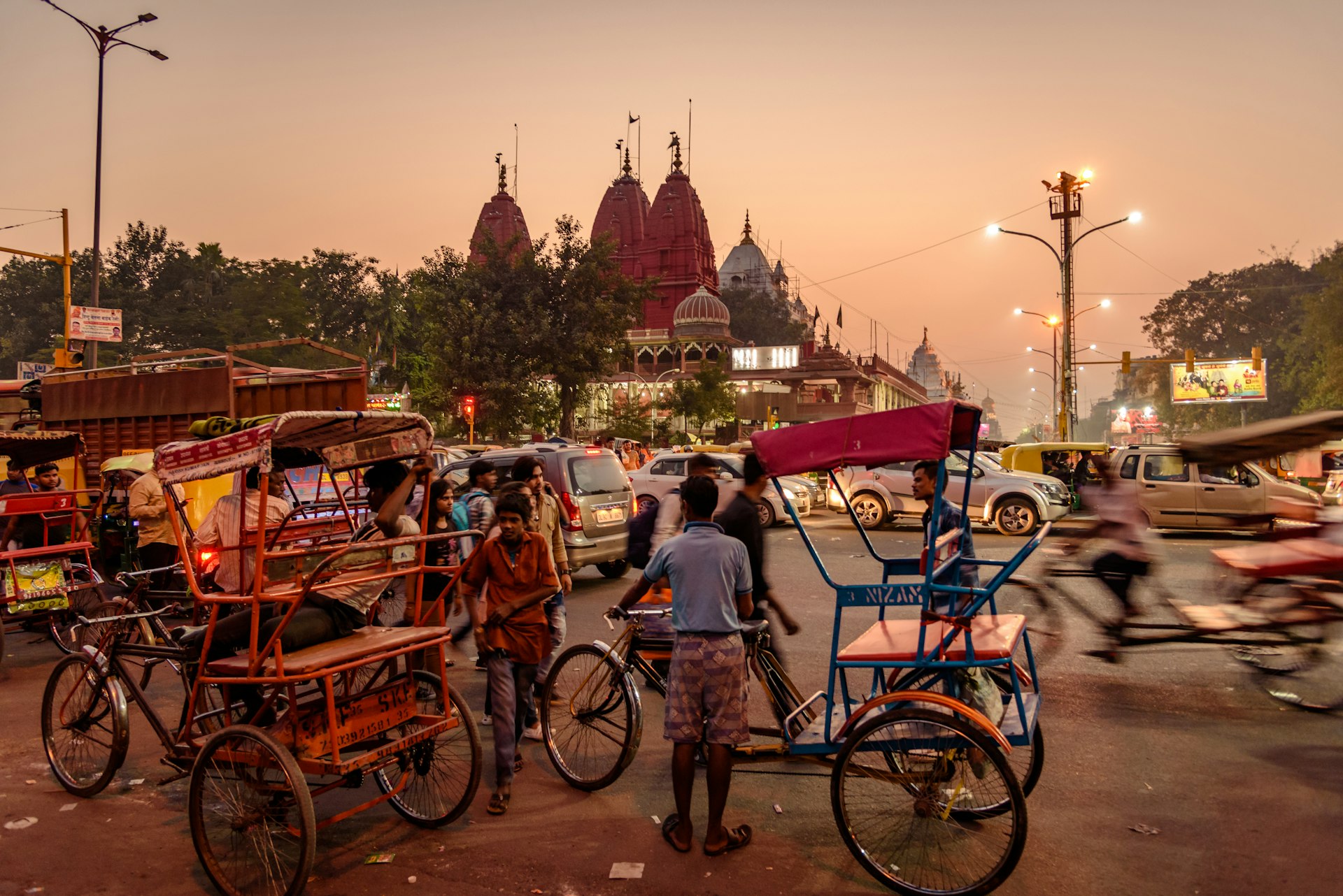 Busy street traffic in Chandni Chowk market with rickshaws in India