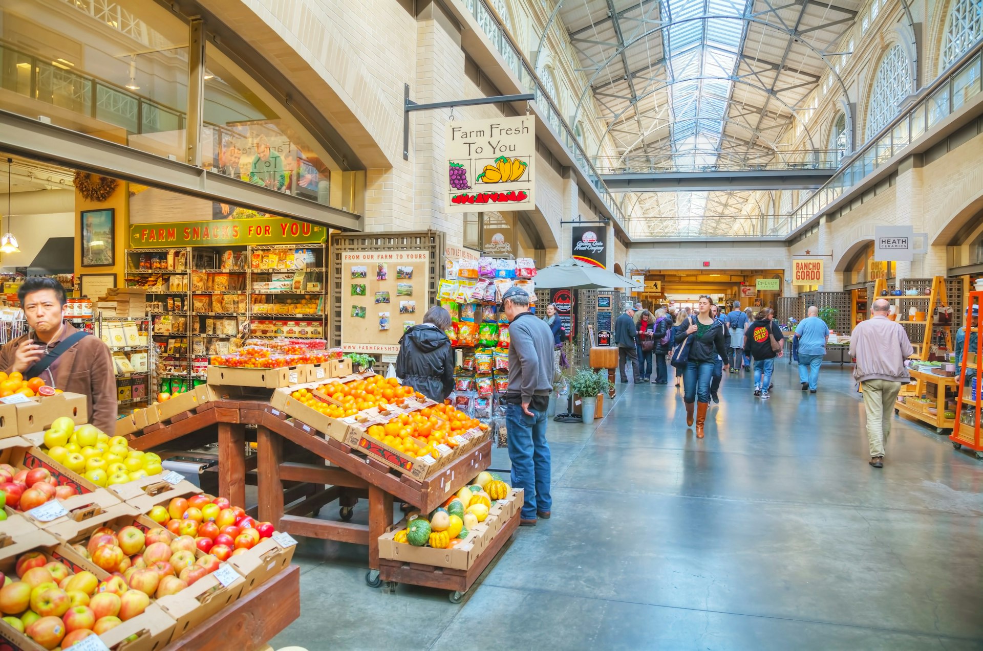Farmers market hall inside the Ferry building in San Francisco, with vendors displaying quality produce