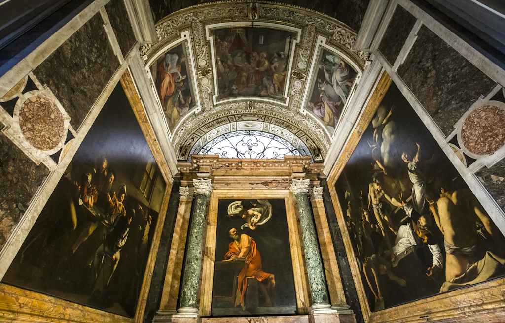 A series of paintings covering the walls and ceiling of a church