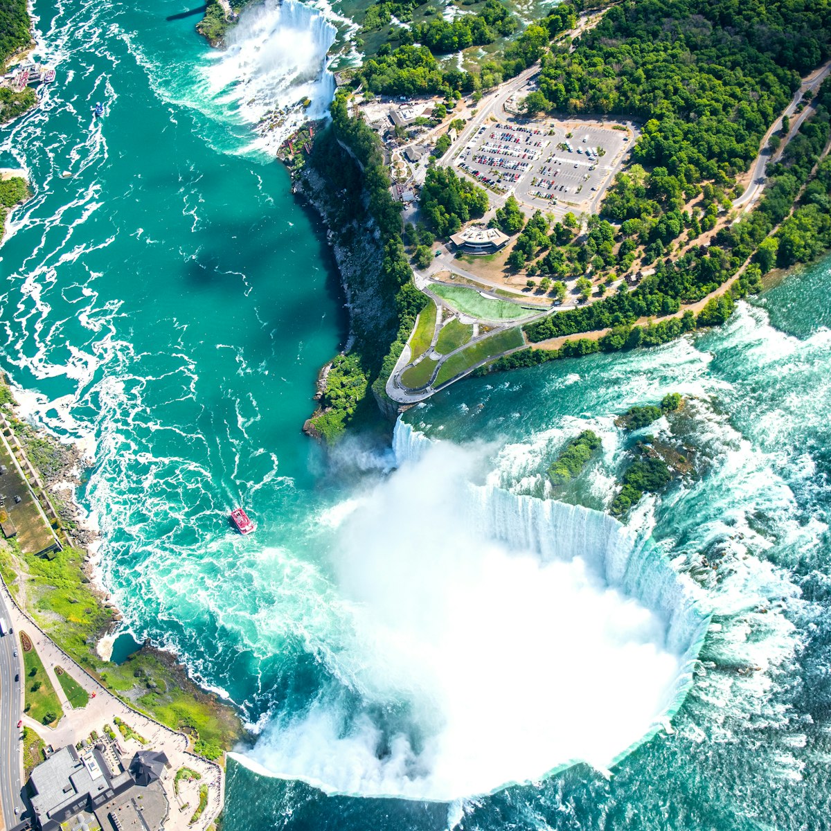 Aerial of Horseshoe Falls at Niagara Falls.
546768265
aerial, amazing, american, awesome, beautiful, beauty, blue, boats, bridge, canada, canadian, color, drop, fall, flow, helicopter view, horseshoe, landmark, landscape, light, maid, majestic, mist, natural, nature, new, niagara, north, ontario, outdoors, park, power, powerful, rainbow, rapids, river, rock, rocky, scenic, sky, spectacular, speed, stunning, toronto, tour, tourism, travel, view, water, waterfall