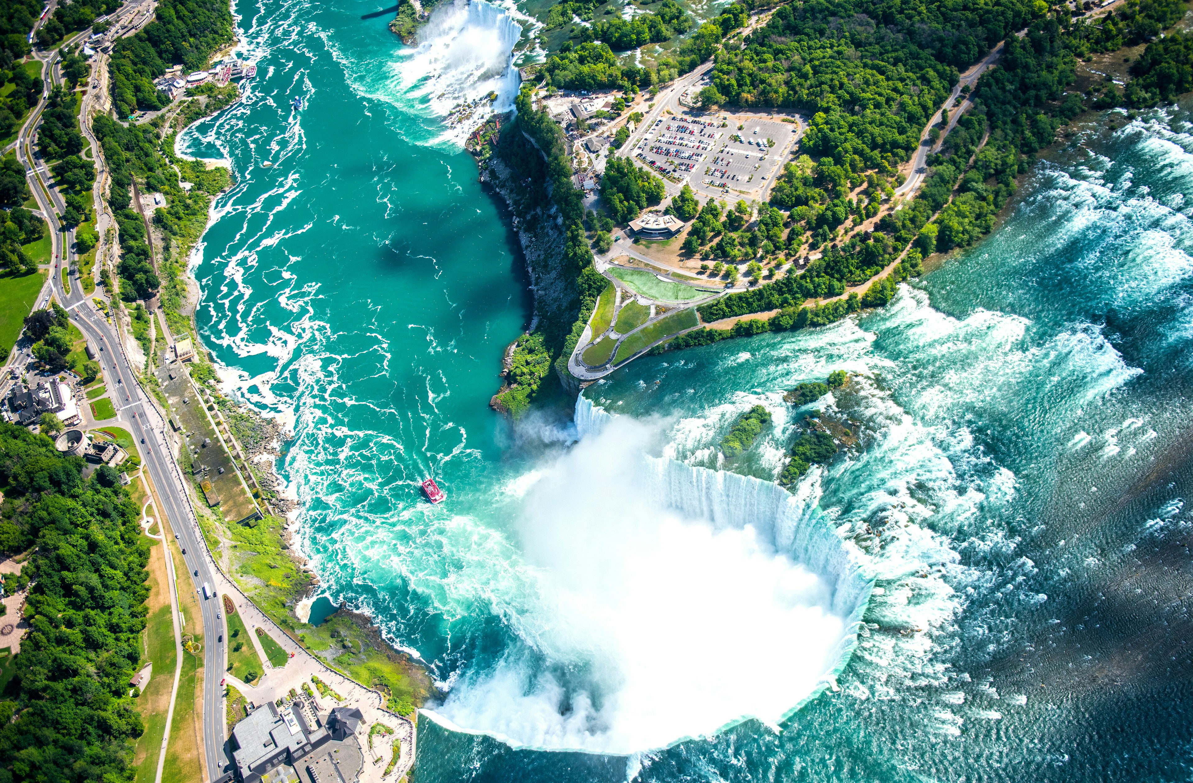 An aerial view of Niagara Falls, a group of three waterfalls at the southern end of Niagara Gorge.