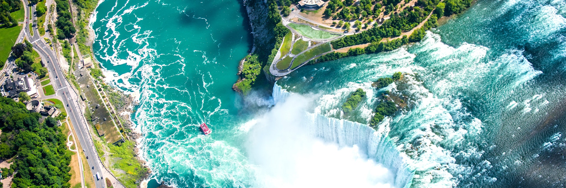 Aerial of Horseshoe Falls at Niagara Falls.
546768265
aerial, amazing, american, awesome, beautiful, beauty, blue, boats, bridge, canada, canadian, color, drop, fall, flow, helicopter view, horseshoe, landmark, landscape, light, maid, majestic, mist, natural, nature, new, niagara, north, ontario, outdoors, park, power, powerful, rainbow, rapids, river, rock, rocky, scenic, sky, spectacular, speed, stunning, toronto, tour, tourism, travel, view, water, waterfall