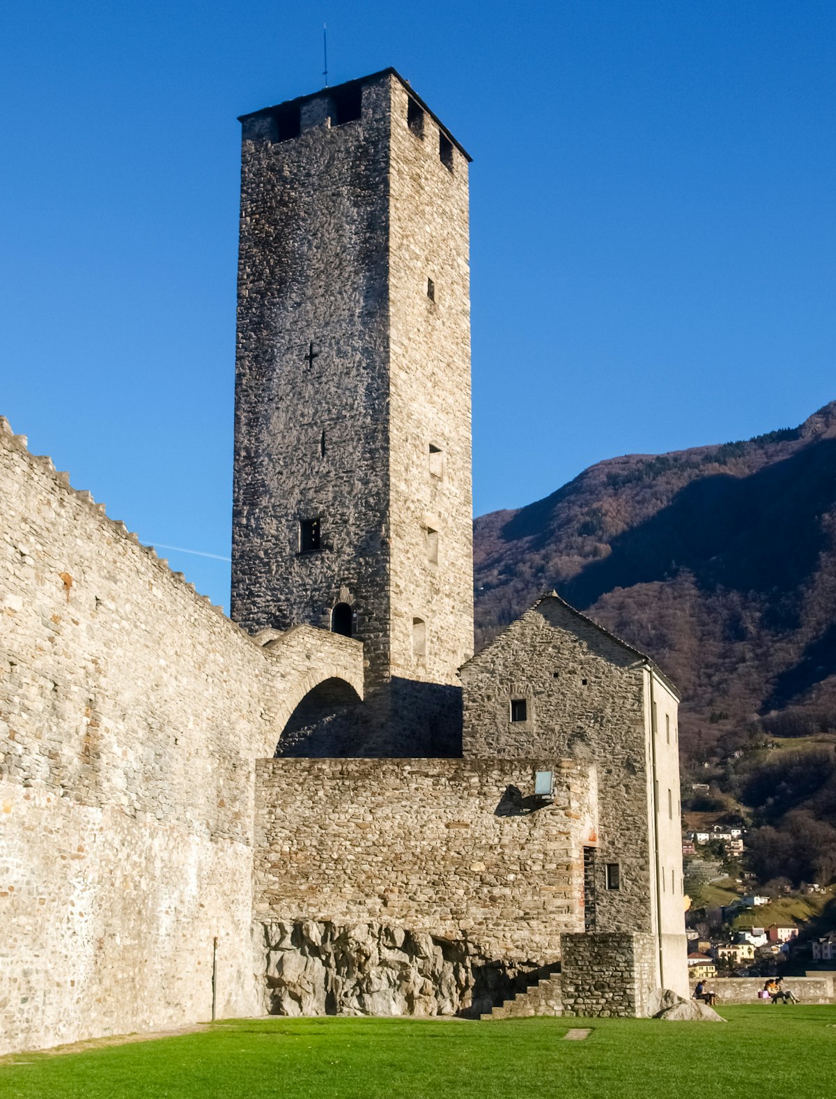 Bellinzona, Switzerland: a tower at Castelgrande with blue sky.
565916194
aged, alps, ancient, architecture, bellinzona, building, castle, church, city, culture, defense, europe, exterior, fort, fortress, hill, historic, historical, history, house, landmark, medieval, monument, mountain, old, outdoor, rock, ruins, stone, swiss, switzerland, ticino, tourism, tourist, tower, town, travel, urban, wall