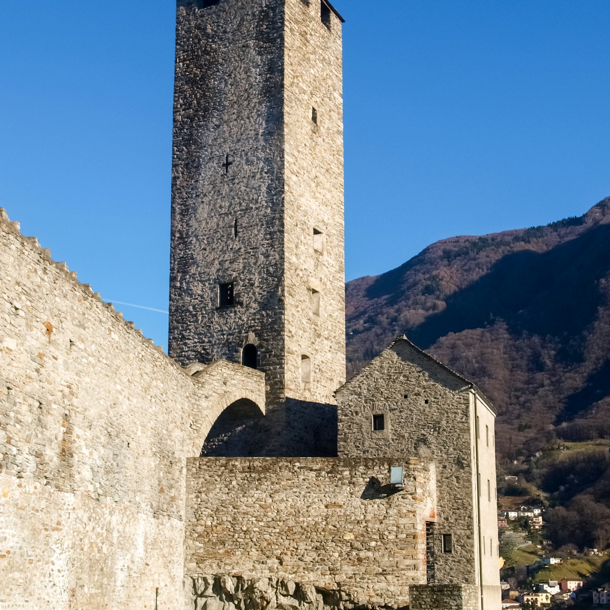 Bellinzona, Switzerland: a tower at Castelgrande with blue sky.
565916194
aged, alps, ancient, architecture, bellinzona, building, castle, church, city, culture, defense, europe, exterior, fort, fortress, hill, historic, historical, history, house, landmark, medieval, monument, mountain, old, outdoor, rock, ruins, stone, swiss, switzerland, ticino, tourism, tourist, tower, town, travel, urban, wall