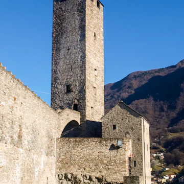 Bellinzona, Switzerland: a tower at Castelgrande with blue sky.
565916194
aged, alps, ancient, architecture, bellinzona, building, castle, church, city, culture, defense, europe, exterior, fort, fortress, hill, historic, historical, history, house, landmark, medieval, monument, mountain, old, outdoor, rock, ruins, stone, swiss, switzerland, ticino, tourism, tourist, tower, town, travel, urban, wall