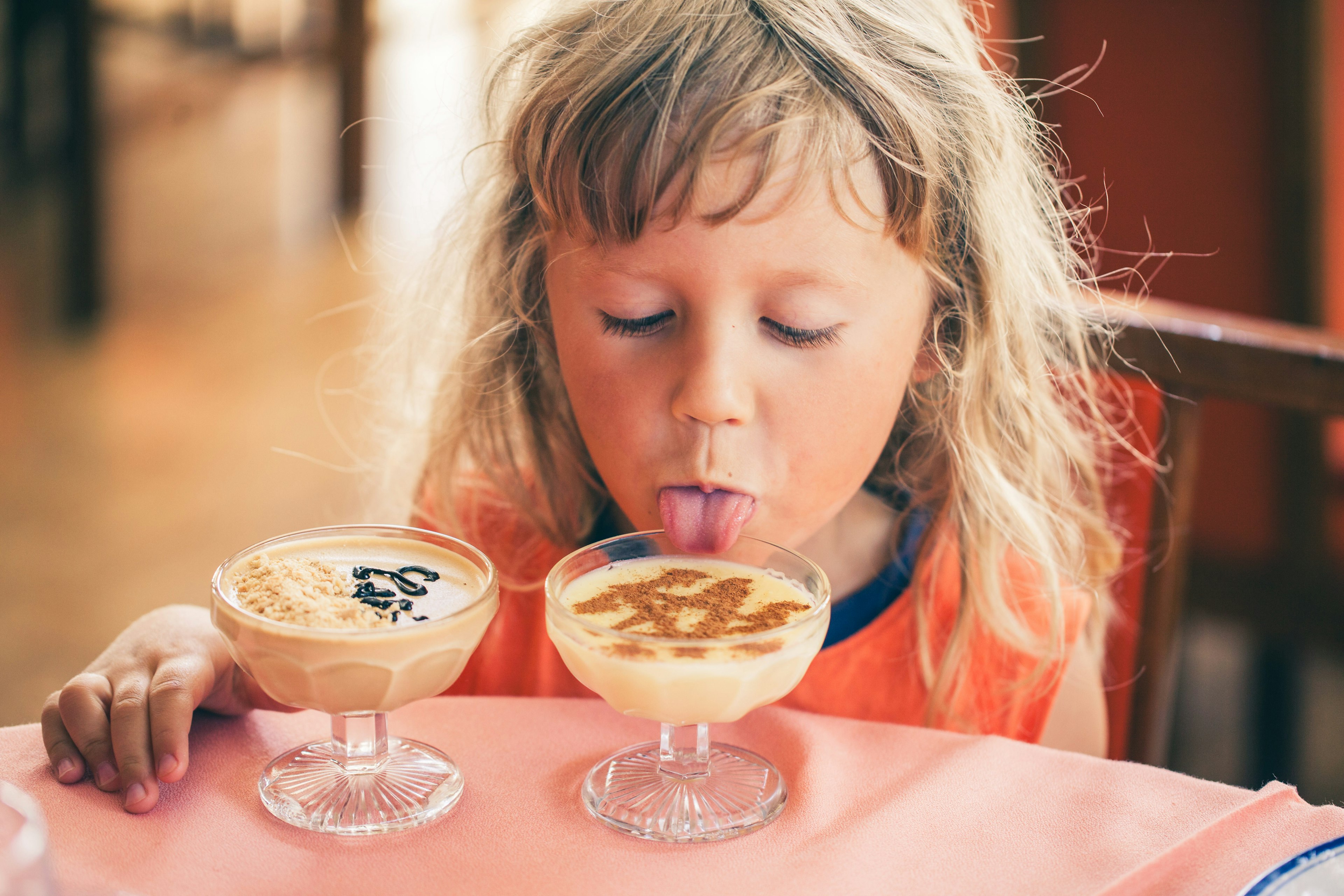 Kid with homemade chocolate mousse in Portugal