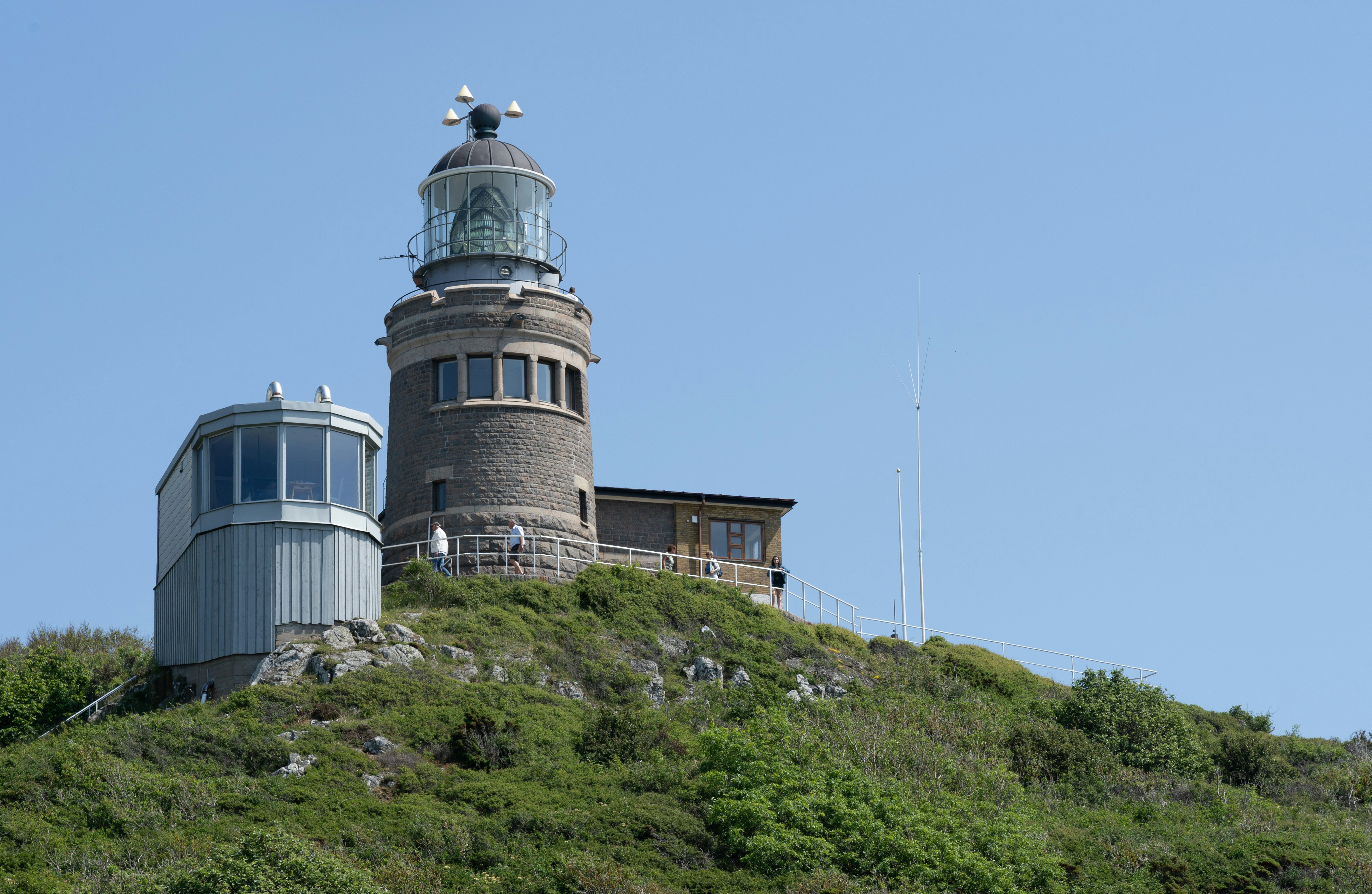 The Kullen Lighthouse on a summer day with clear blue sky at Kullaberg Nature Reserve in South Sweden.