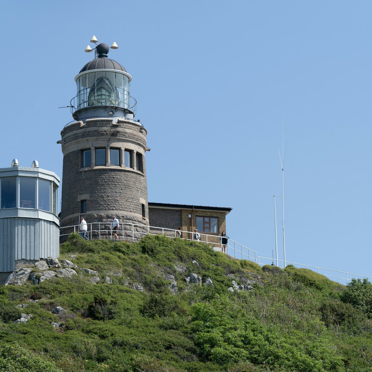 The Kullen Lighthouse on a summer day with clear blue sky at Kullaberg Nature Reserve in South Sweden.