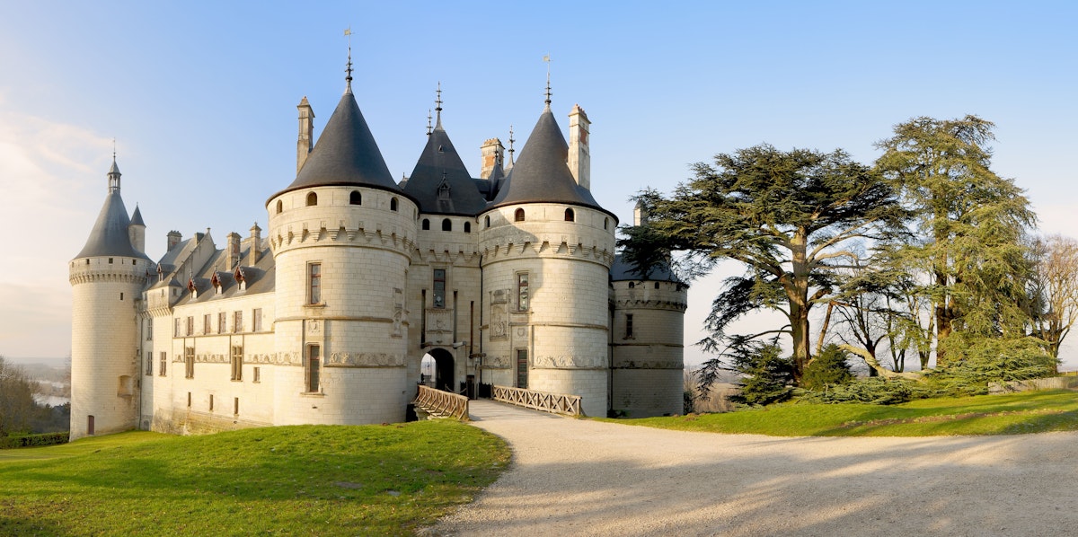 Chaumont Castle in Loire Valley France - Panoramic wide view to the entrance and the garden at sunrise with trees, grass under blue sky;,,Château de Chaumont-sur-Loire,,Shutterstock ID 1467775043; your: Bridget Brown; gl: 65050; netsuite: Online Editorial; full: POI Image Update