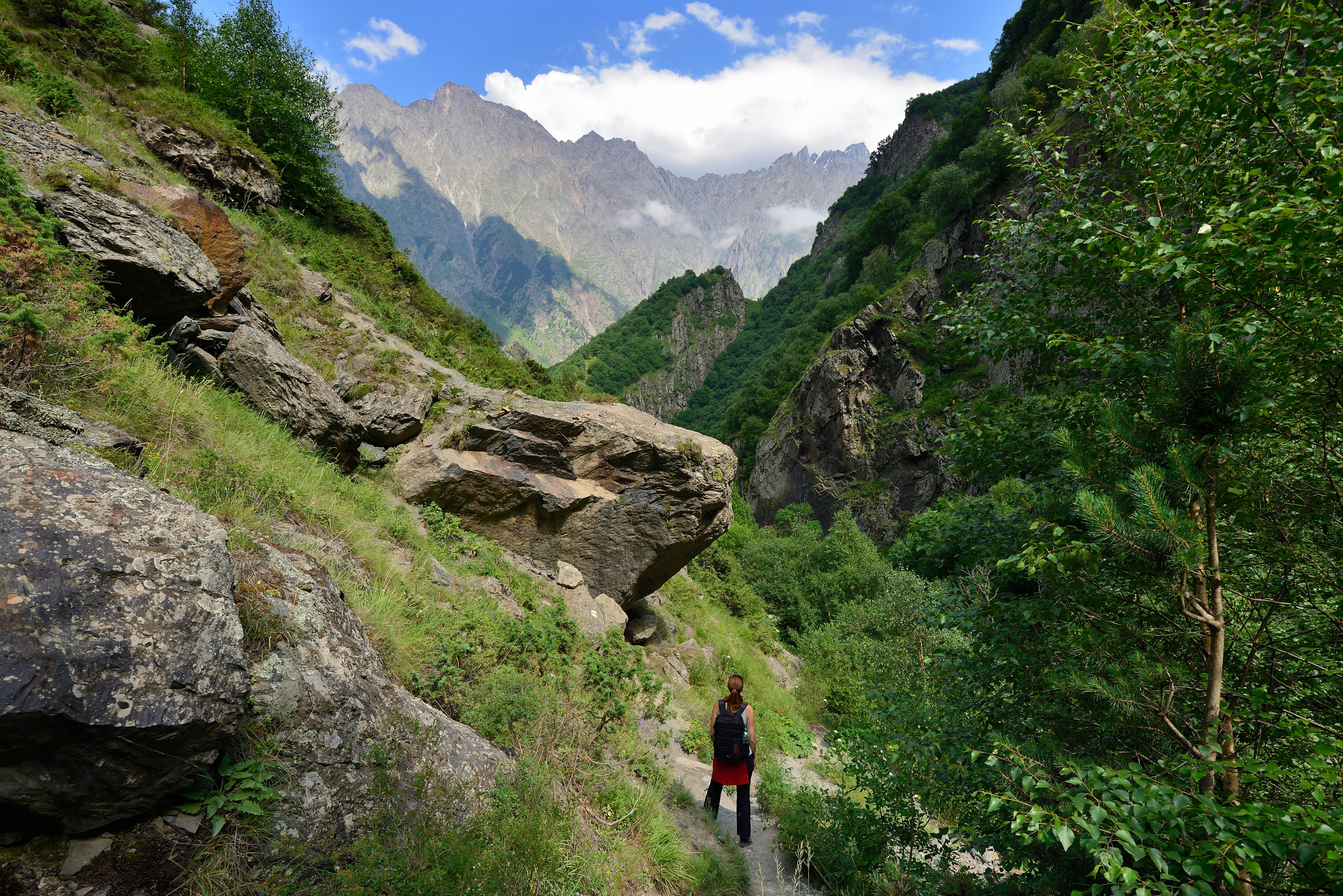 A hiker in Dariali Gorge near Kazbegi, Georgia