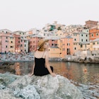 Portrait of young caucasian woman resting in Genoa.
1029786666
A young woman sitting on a rock by the sea in Genoa