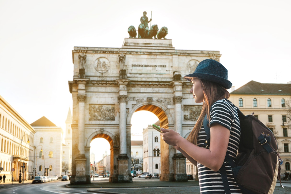 A tourist girl with a backpack looks sights in Munich in Germany. Passes by the triumphal arch.
1030263060
A woman with a backpack looks at sights in Munich, Germany. The victory arch is in the background.
