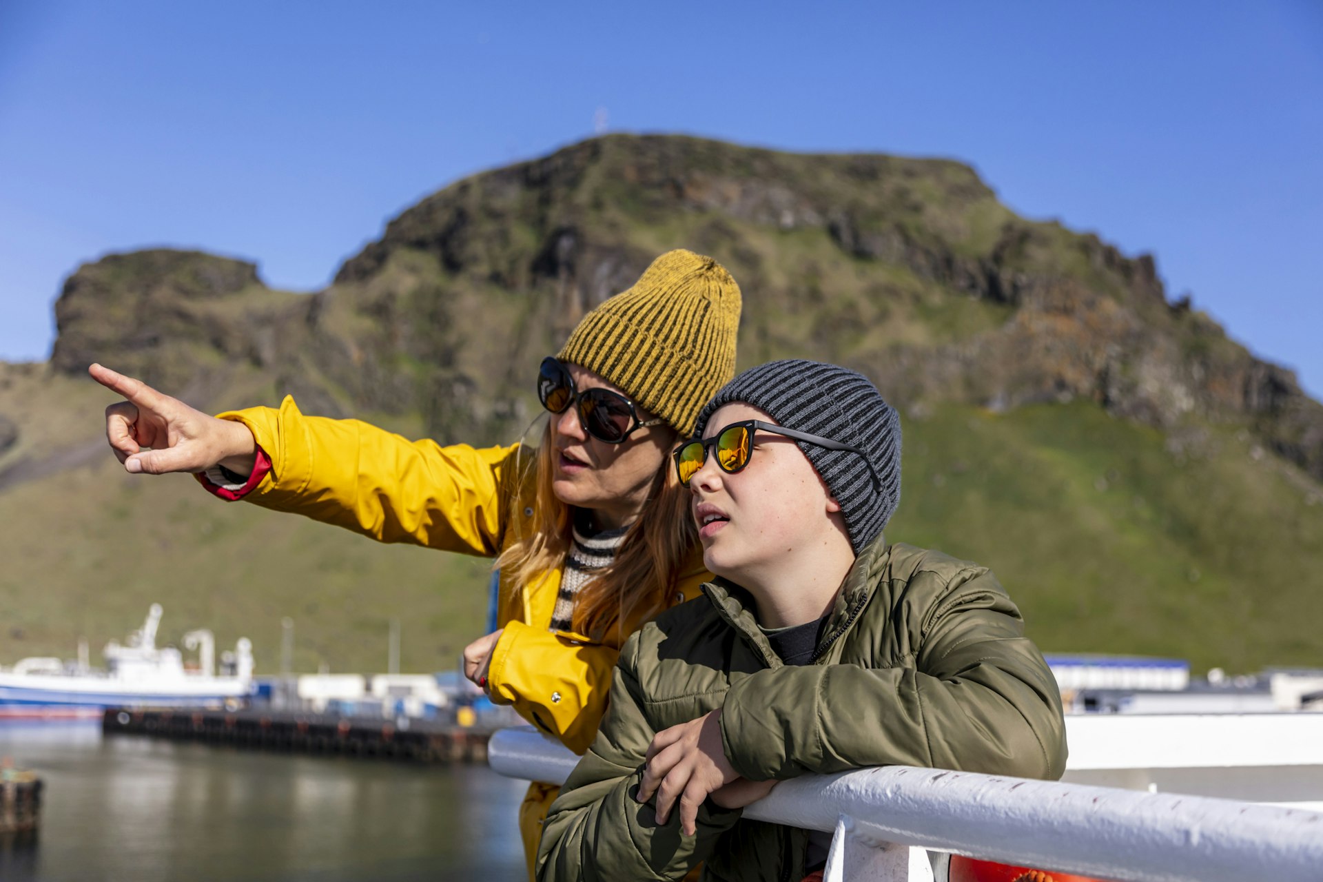 Mother and son are traveling to Westman island by ferry in Iceland