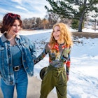 This is a photograph of Hispanic teenager sisters walking outdoors on a sunny winter day in Denver, Colorado. Snow fills the landscape in the background.
1162217991