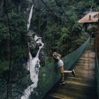 Woman wearing shorts on a suspension bridge looking to a waterfall in Ecuador. Self-Portrait catch-all release.
1167062305
A woman looking over the side of a suspension bridge at a waterfall in Ecuador