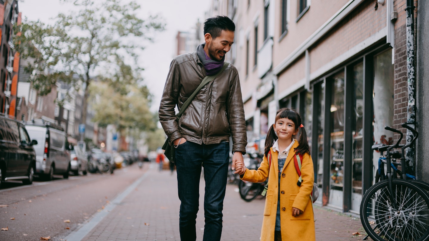 Japanese father and mixed race young girl holding hands and walking on street in Amsterdam, Netherlands
1183025558
A man and his daughter walking down the street in Amsterdam while holding hands.