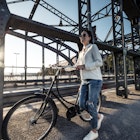 1186934251
active, bike, bridge, casual, content, dark hair, evening, evening mood, evening sun, female south european, glasses, leisure, road bridge, southern european ethnicity, sustainability, woman
A young woman walking along a bridge in Munich with a bicycle