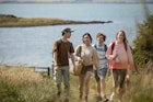 Wide angle shot of a group of mixed ethnic teens on a walk along the coastline together at Holy Island in the North East of England in summer.
1398830993