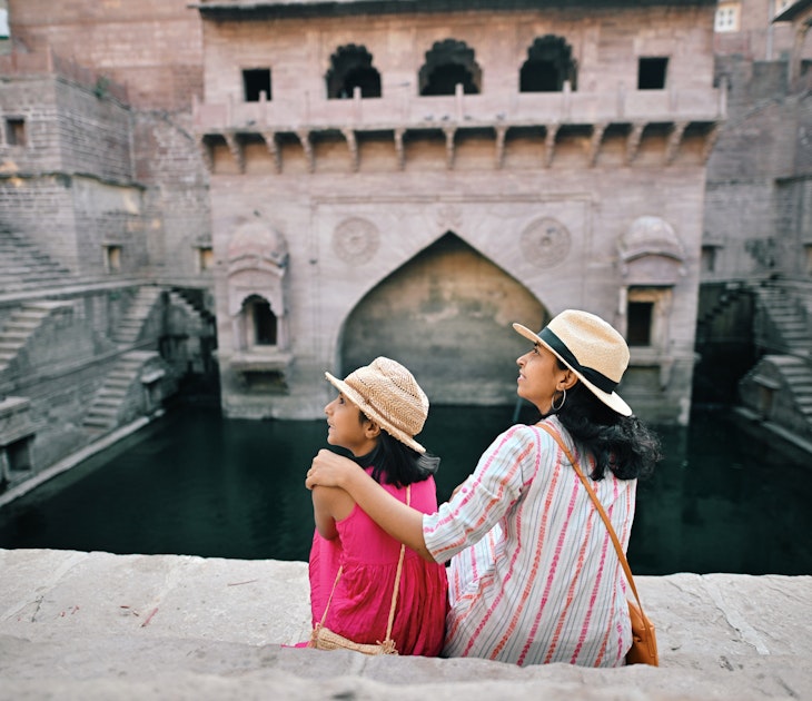 Rear view of tourist mother and daughter wearing a hat sitting at a step well (Toorji Ka Jhalra) in Jodhpur, Rajasthan
1441715953
Rear view of a mother and daughter wearing hats and sitting at a step well (Toorji Ka Jhalra) in Jodhpur, Rajasthan