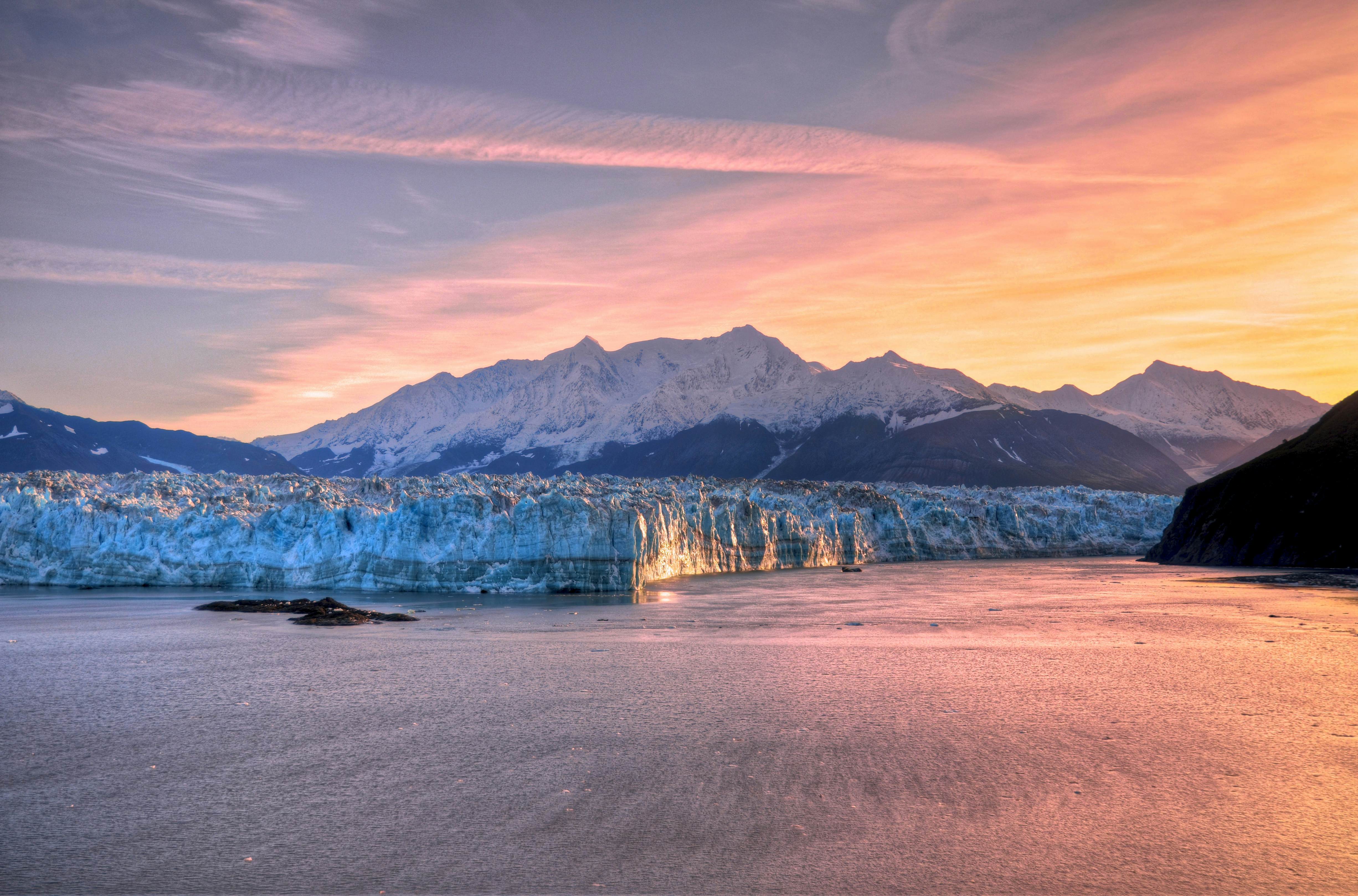 Sunrise at Hubbard Glacier with mountain in Alaska.
