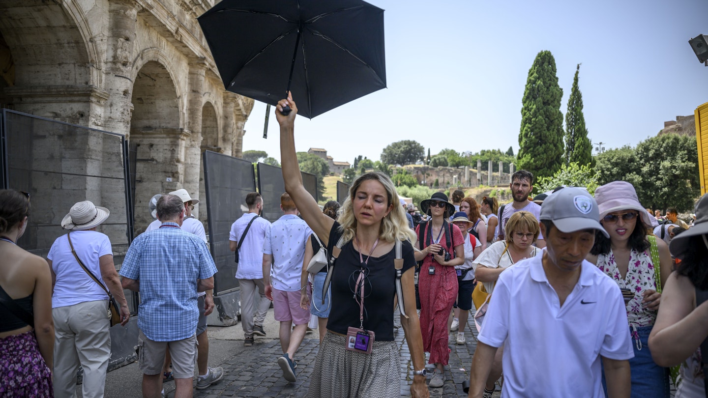 ROME, ITALY - JULY 17: A woman uses an umbrella for shade during an ongoing heat wave with temperatures reaching 44 degrees, at Colosseo area (Colosseum), on July 17, 2023 in Rome, Italy. The government has issued red alerts for 16 cities due to the current heatwave, which the Italian Meteorological Society named Cerberus, the mythical creature who guarded the gates of the underworld. Many places in Italy have seen successive days over 40C. (Photo by Antonio Masiello/Getty Images)
1538005086