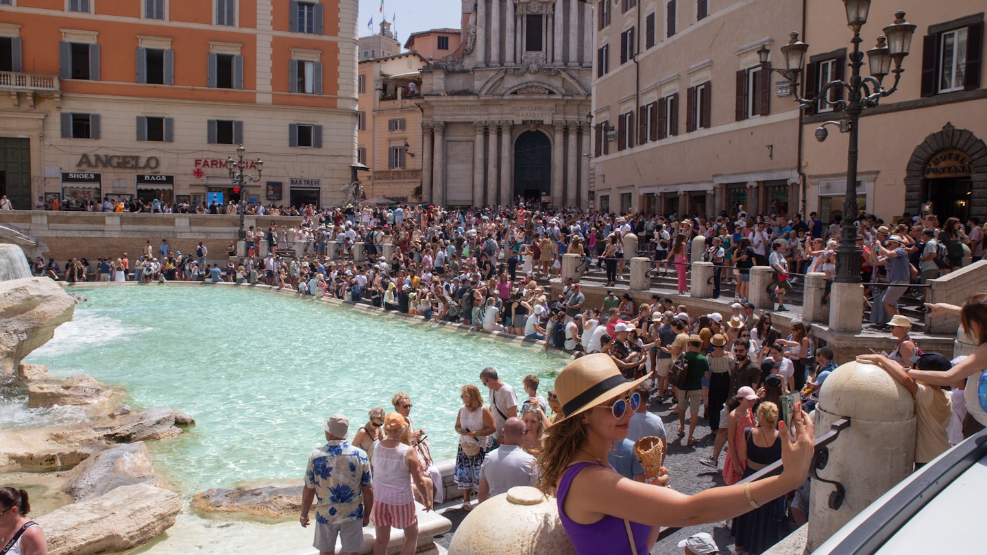 ROME, ITALY - 2023/07/17: A woman takes a selfie with an ice cream in front of Trevi Fountain on a hot summer day. (Photo by Matteo Nardone/Pacific Press/LightRocket via Getty Images)
1539939184
rome, tourists, turisti, hot, hot weather, heatwave