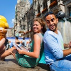460705281
germany, bavaria, munich, ice cream, mid adult couple, munich marienplatz, fountain, city, travel destination, tourism, travel, vacation, city break, outdoors, urban, town square, summer, day, sitting, smiling, temptation, togetherness, happiness, 30 to 34 years, middle eastern ethnicity, caucasian ethnicity, female, woman, mid adult woman, male, man, mid adult man, tourist, people in the background, sweet flavor, yellow, sweet food, munich, bavaria, germany