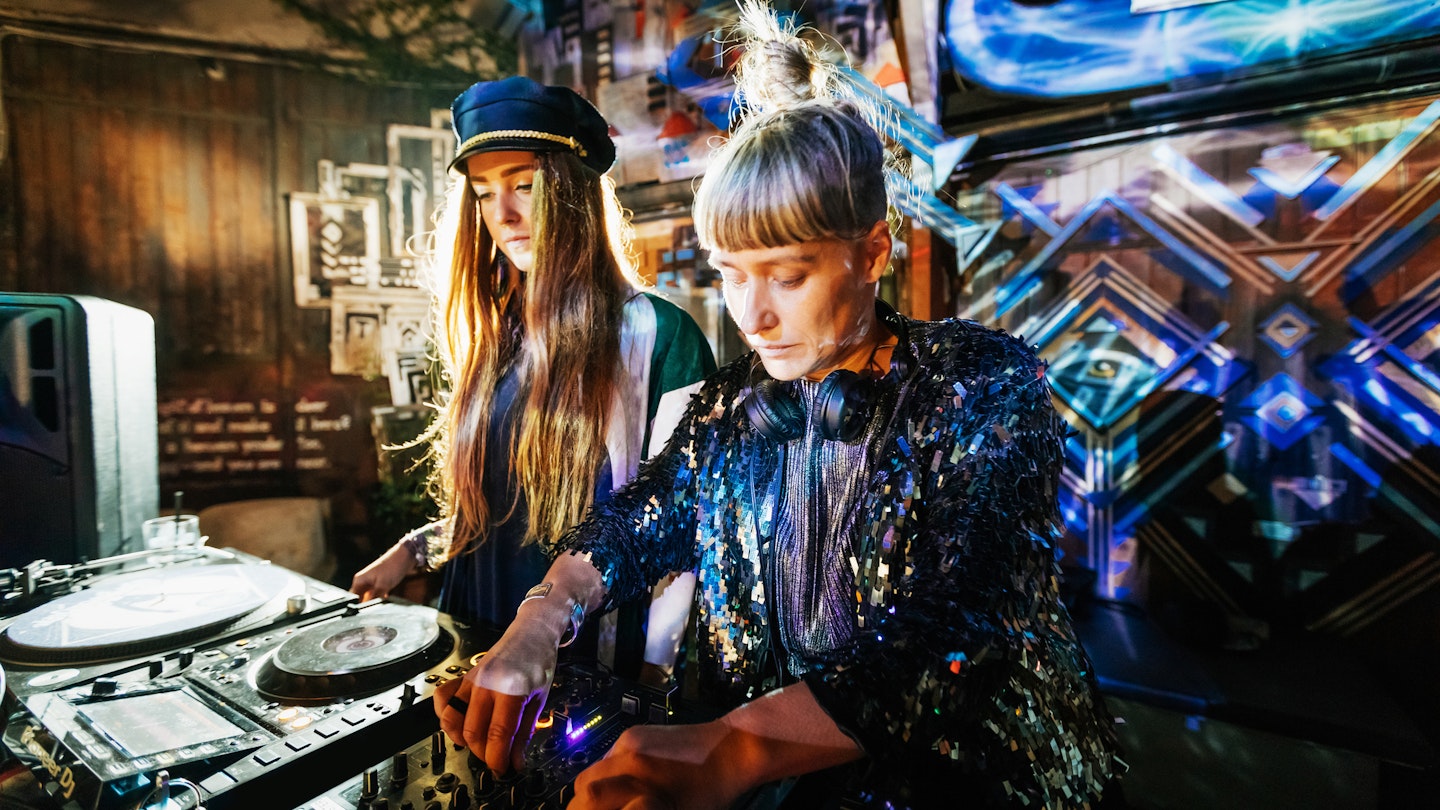 Two stylish DJs performing together late into the night at a colourful open air nightclub.
870196306
Two stylish DJs performing together at an open air nightclub in Berlin.