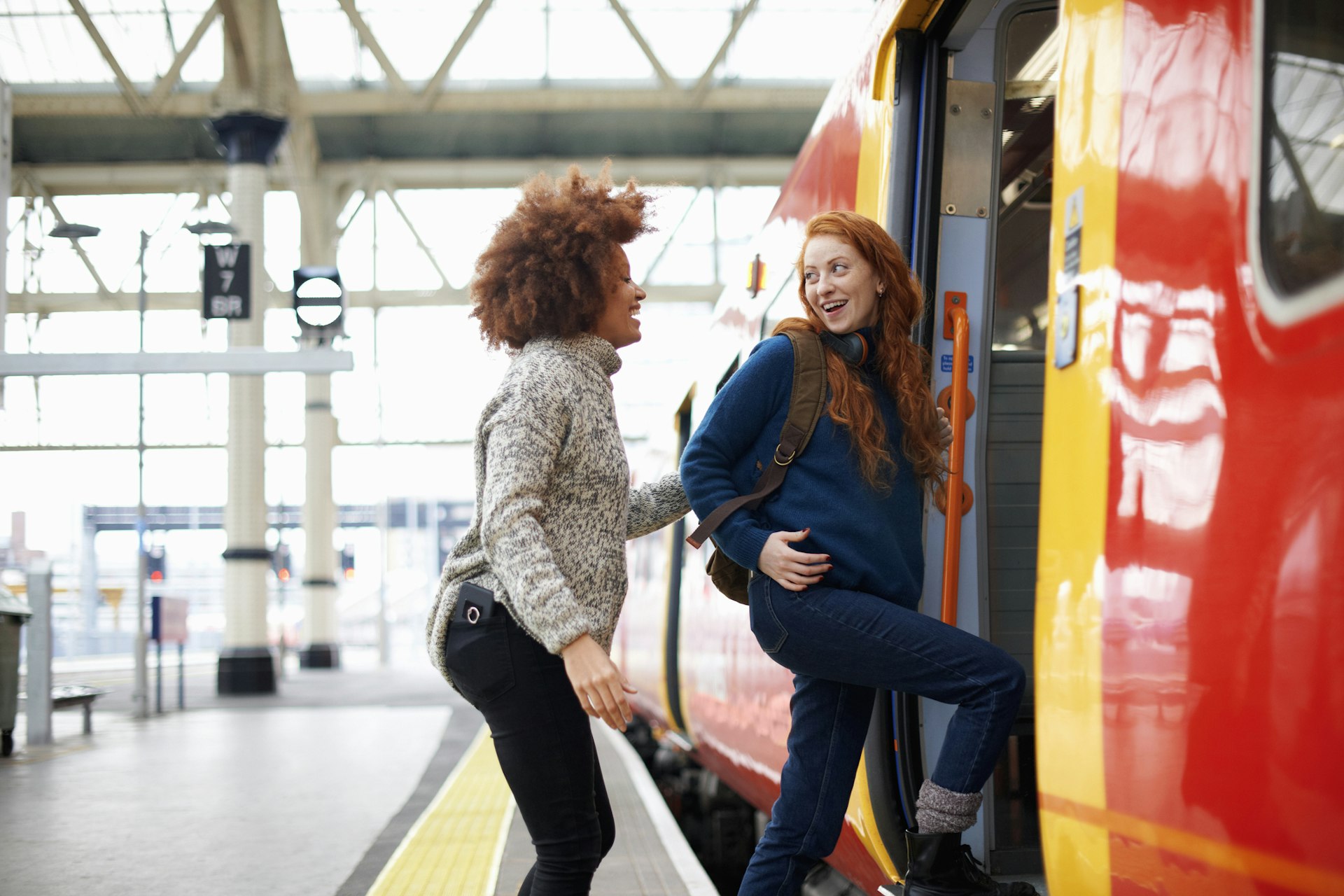 Two friends board a train