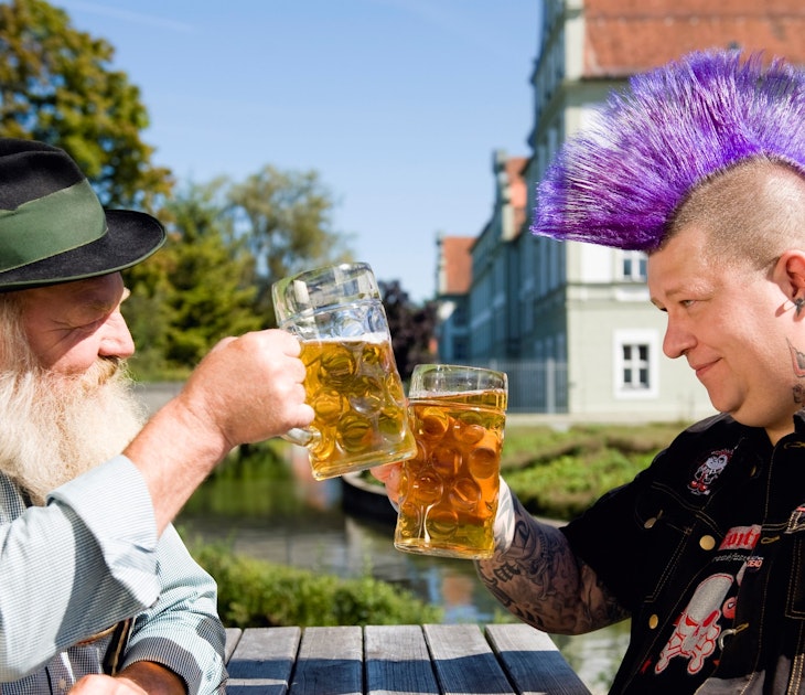 93225459
30-34 years, 35-39 years, 65-69 years, Bavaria, Caucasian, Color Image, Germany, Horizontal, Photography, Two people, Upper Bavaria, adults only, beard, beer, beer garden, beer stein, building exterior, contrasts, day, drinking, dyed hair, enjoyment, face to face, food and drink, friendship, grey hair, head and shoulders, holding, individuality, leisure, lifestyles, mid adult men, mohawk, only men, outdoors, purple, refreshment, relaxation, senior men, series, side view, sitting, tattoo, toast, togetherness, traditional clothing, traditionally german