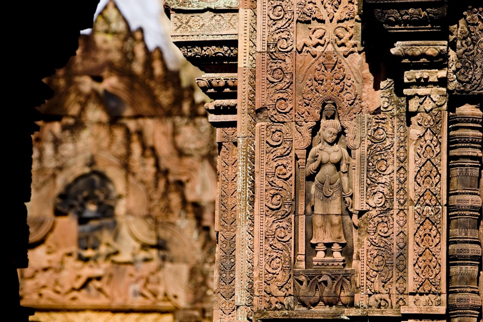 26408-45
Asia, Cambodia, Siem Reap, South-East Asia, aged, architecture, architecture and art, art, built structure, carving, close-up, culture, day, female likeness, focus on foreground, history, horizontal, human representation, no people, old, outdoors, past, sculpture, statue, wall
Bas-relief detail, Banteay Srei.