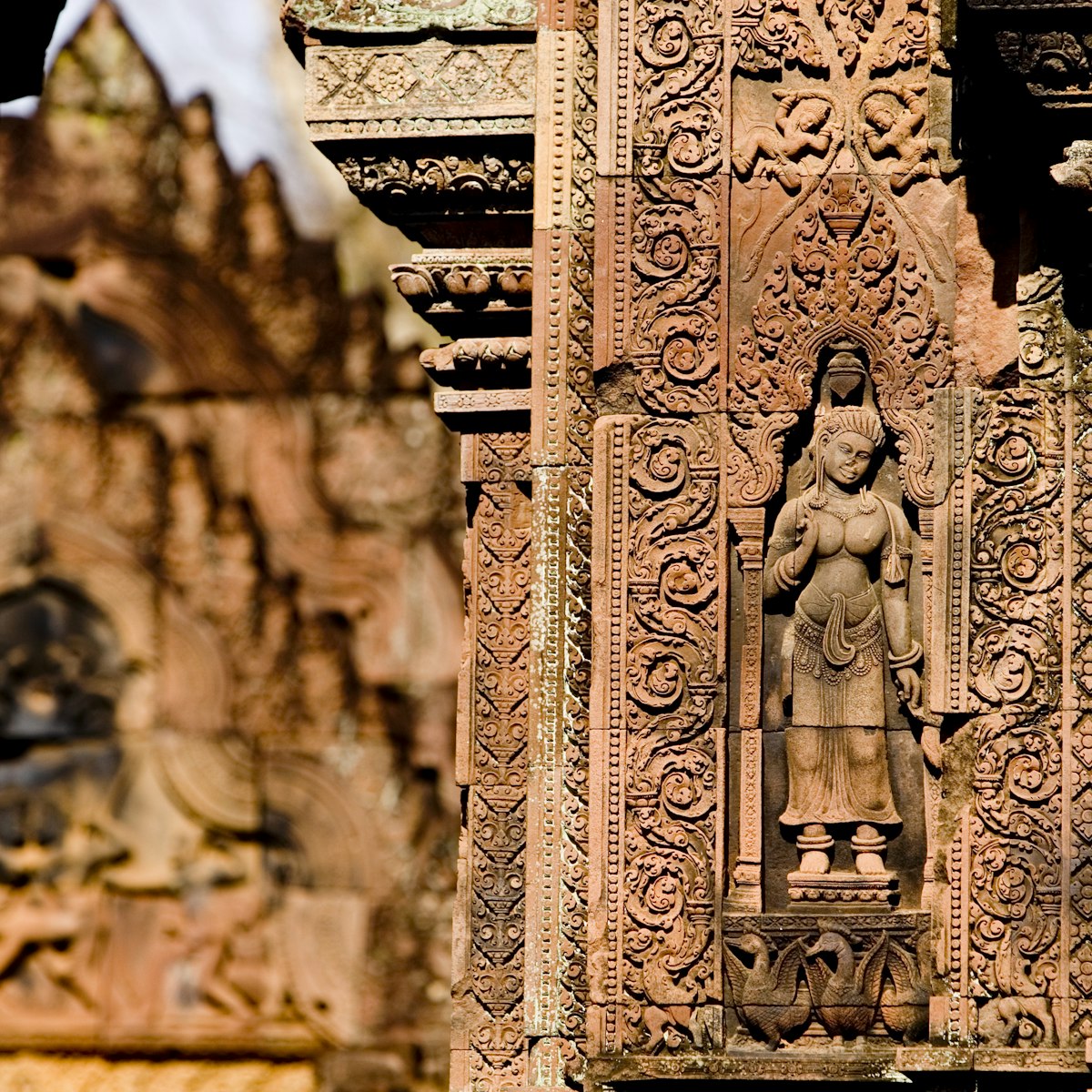 26408-45
Asia, Cambodia, Siem Reap, South-East Asia, aged, architecture, architecture and art, art, built structure, carving, close-up, culture, day, female likeness, focus on foreground, history, horizontal, human representation, no people, old, outdoors, past, sculpture, statue, wall
Bas-relief detail, Banteay Srei.