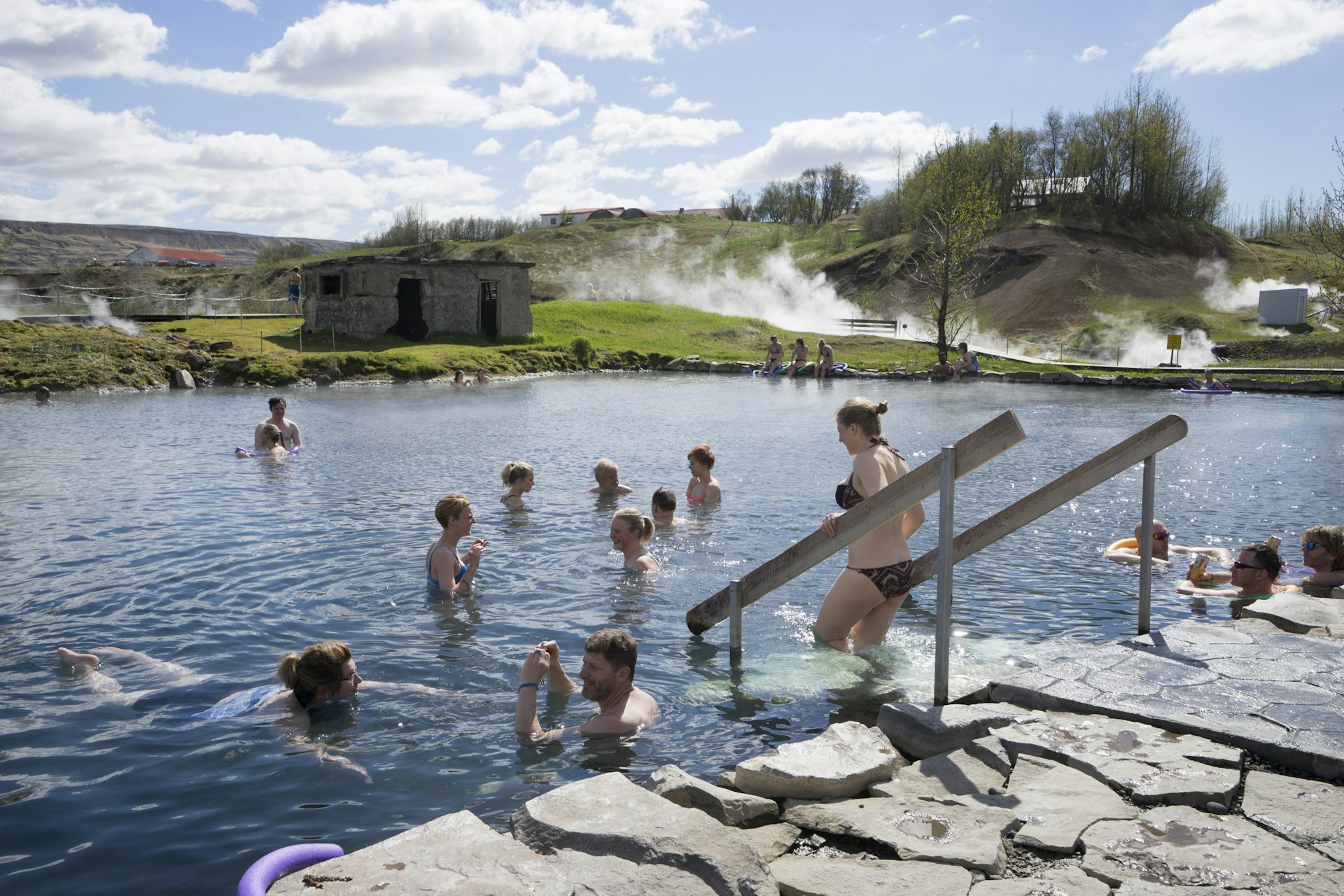 People enjoying a soak in some hot springs