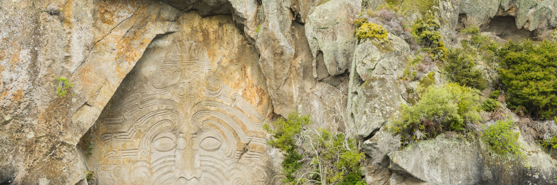 Maori rock carving at Mine Bay, Lake Taupo, North Island, New Zealand.