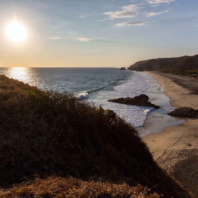 Sunset over the pacific ocean from a hill in Punta Cometa, Mazunte, Mexico.
