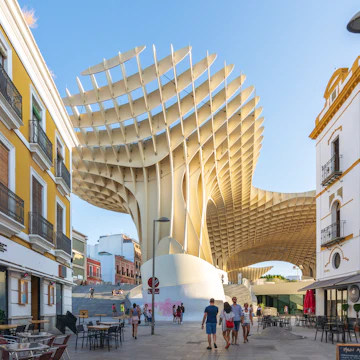 View of Regina street. In the background the Metropol Parasol (by architect Jurgen Mayer H). Taken in the summer of 2018 Sevilla, Spain