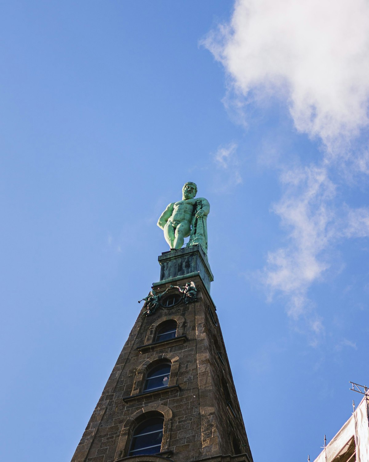 A vertical shot of the Hercules monument in Wilhelmshoehe Castle Park in Kassel, Germany.