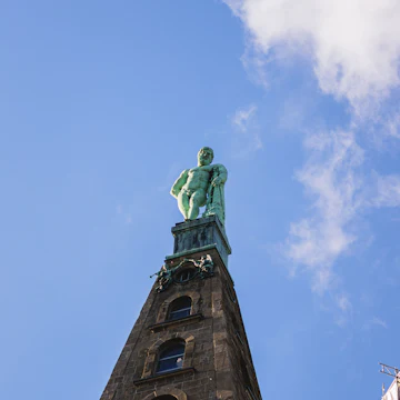 A vertical shot of the Hercules monument in Wilhelmshoehe Castle Park in Kassel, Germany.