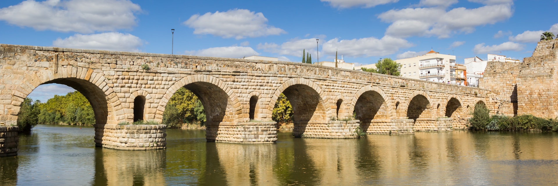 The historic roman bridge Puente Romana over the Guadiana river in Merida, Spain.